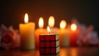 photograph, Quaint Magical Candles Rubik s cube , simple background, soft focus
