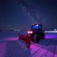 stylized by Michael Wesely and Marc Lagrange , photograph, Radiant, extreme wide shot of a Lovecraftian Snow plow