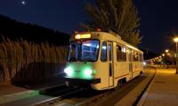 art by Dorothea Lange and Zhang Kechun , photograph, masterpiece, medium shot of a Boorish Translucent Cameroonian Tram