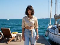 fashion photography,of a woman as a monster hunter with french bob haircut In minimalist fashion,elegant with clean lines and neutral tones ,dressed in cream crop top