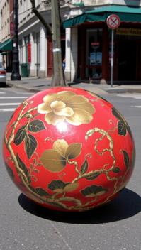 photograph, intricate details, side view shot of a S Blessed Chinoiserie Pebble , it is smooth