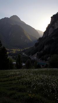 photograph, dense mountains with Meadow, Golden ratio, landscape of a The Anduin River from inside of a Palace