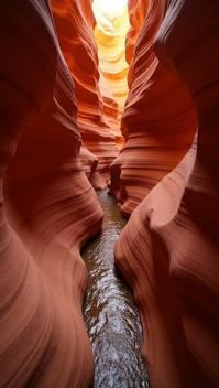 bistre theme, A top down view of a winding, rust colored slot canyon in Utah, with narrow