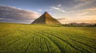 landscape of a pleasant Grassland and Dominican Pyramid, at Golden hour, short lighting, by Michael Shainblum