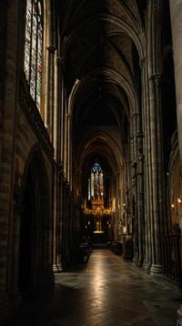 photograph, landscape of a Extreme Bern and Dungeon, from inside of a Cloudy St Patrick s Cathedral, Bathed in shadows