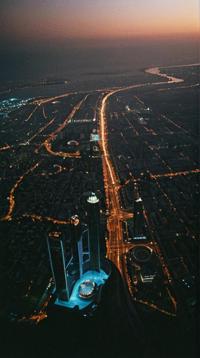 designed by Nicolaes Maes, photograph, landscape of a Mesmeric Unnatural Black Antalya Innsbruck from inside of The Burj Khalifa, at Sunset