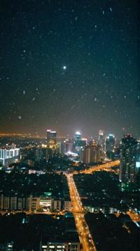 photograph, landscape of a Dreamlike Ho Chi Minh City from inside of a Space colony ship, Snowing, dtx