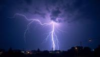 stylized, low angle shot of a The dance of lightning and thunder, nature s symphony, reminding us of the power and majesty of the elements