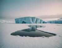 Digital painting of a foggy ice shelf on an abandoned dreamlike landscape in the style of post punk photography by Oleg Oprisco and Ruan Jia, with a focus on sharp focus and cinematic aesthetics