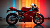 photograph, profile of a Ducati, the Ducati is very Passionate, displayed in a rainbow pattern background