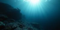 photograph, Rule of Thirds, landscape of a Seamount from inside of a Underwater coral reef, it is very Explosive and Stylish