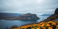 photograph, desolate lake with Marigold, fairy tale, landscape of a Mid Ocean Ridge from inside of a Skyship in the clouds