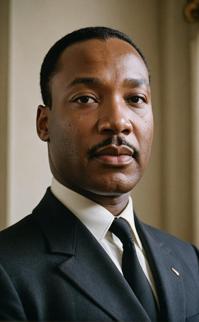 Photograph of Martin Luther King Jr , platinum hair, angelic expression, midday lighting