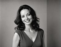 radiant smile, plump Joanne Whalley, ultra real, charcoal gray