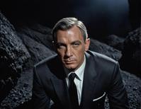 photograph, James Bond , tired expression, grey hair styled as Box braids