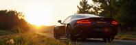 photograph, elegant, rear angle of a Deafening Mecha Tudor Aston Martin of Invasion , it is sleek