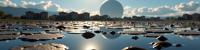 photograph, ethereal, landscape of a Brilliant Warlike Tidal Flats from inside of a Apartment, dense city street and Planetary ring in background